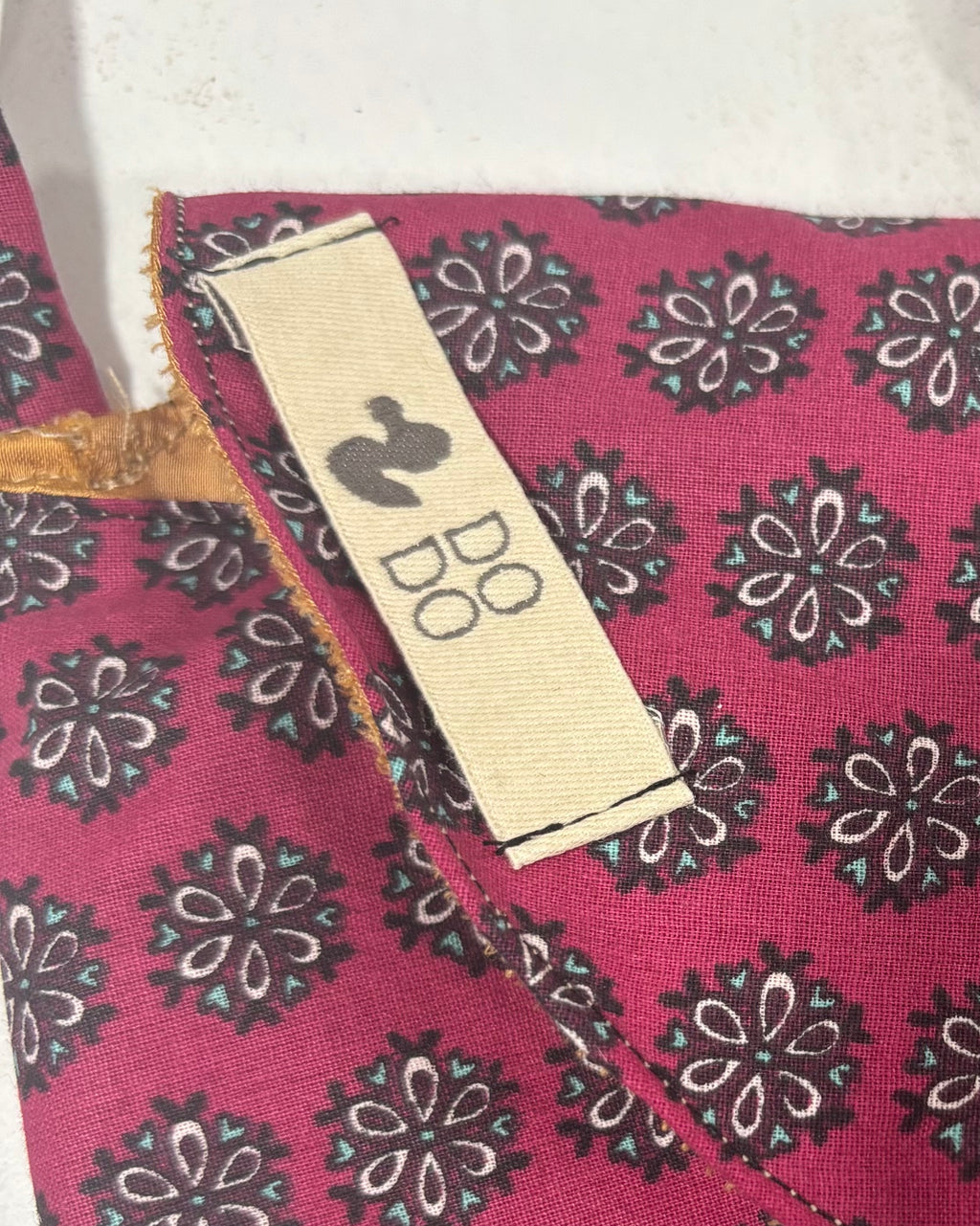 Bolso Bandolera Dodo: Flores Geométricas Granate